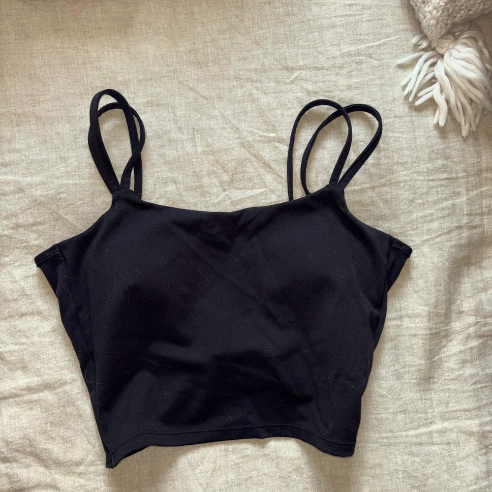Black sports bra which a twisted open back